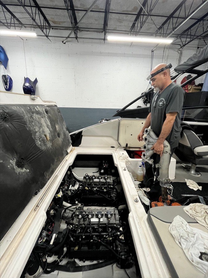 Mechanic working on a jet boat engine